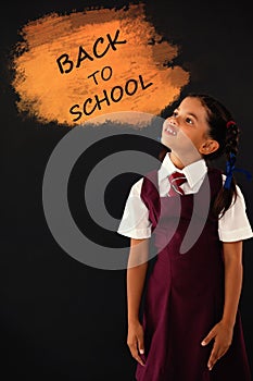 Composite image of digital composite image of back to school text on blue spray paint