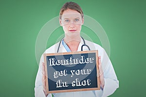 Composite image of doctor showing chalkboard