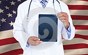 Composite image of a doctor showing digital tablet
