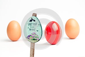 Composite image of easter egg hunt sign