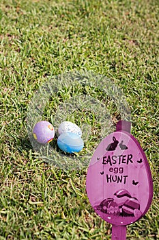 Composite image of easter egg hunt sign