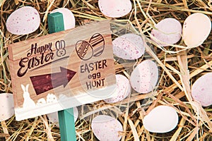 Composite image of easter egg hunt sign