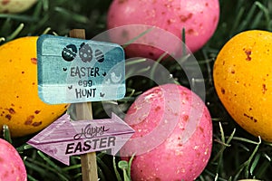 Composite image of easter egg hunt sign