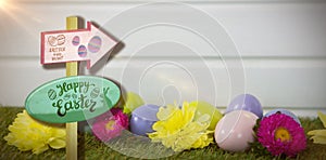 Composite image of easter egg hunt sign