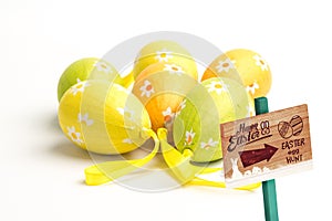 Composite image of easter egg hunt sign
