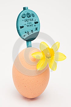 Composite image of easter egg hunt sign