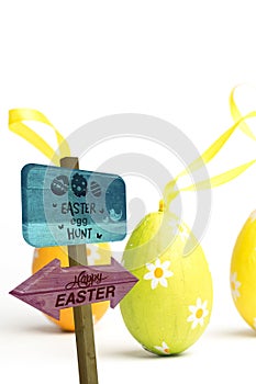 Composite image of easter egg hunt sign