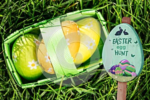 Composite image of easter egg hunt sign