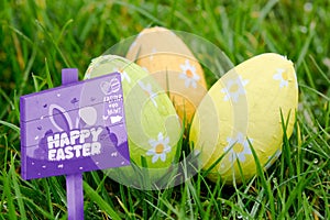 Composite image of easter egg hunt sign