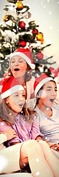 Composite image of extended family singing carols