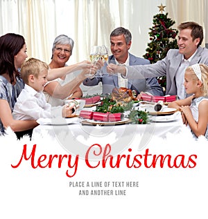 Composite image of family drinking a toast in a christmas dinner