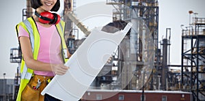 Composite image of female architect holding blueprint against white background