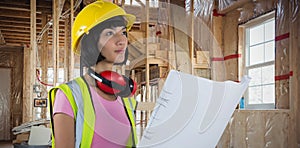 Composite image of female architect holding blueprint against white background