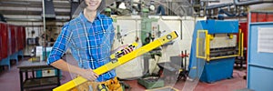 Composite image of female architect holding measuring equipment against grey background