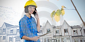 Composite image of female architect talking on mobile phone