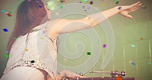 Composite image of female dj playing music while waving hand