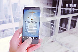 Composite image of female hand holding a smartphone