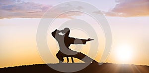 Composite image of fighter performing karate stance