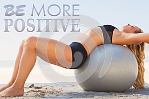 A Composite image of fit blonde stretching her back on exercise ball at the beach photo