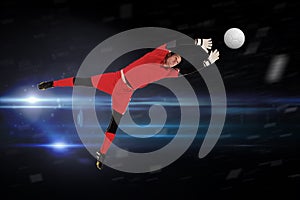 Composite image of fit goal keeper jumping up