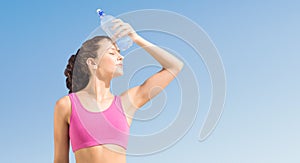 Composite image of fit woman with water