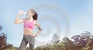 Composite image of fit woman with water