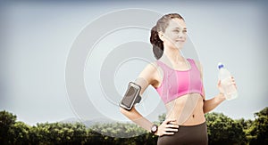 Composite image of fit woman with water