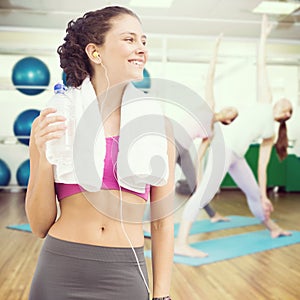 Composite image of fit woman with water