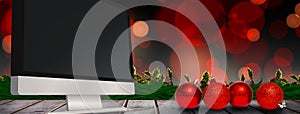 Composite image of four red christmas ball decorations