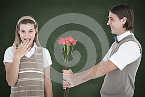 A Composite image of geeky hipster offering red roses to his girlfriend