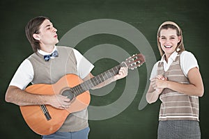 A Composite image of geeky hipster serenading his girlfriend with guitar photo