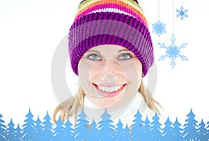 Composite image of glowing young woman wearing white pullover and colorful hat