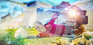 Composite image of goalkeeper in red making a save