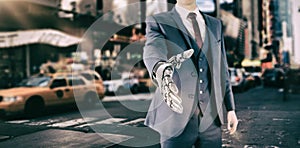 Composite image of graphic image of businessman with robotic hand