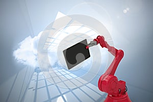 Composite image of graphic image of digital tablet held by red robot 3d