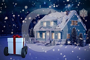 Composite image of gray gift box with wheels