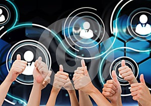 Composite image of group of hands giving thumbs up