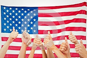 Composite image of group of hands giving thumbs up