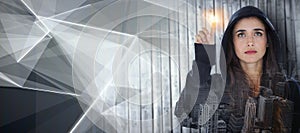 Composite image of hacker using digital screen