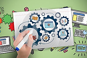 Composite image of hand holding black crayon