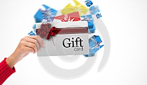 Composite image of hand holding card