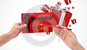 Composite image of hand holding card