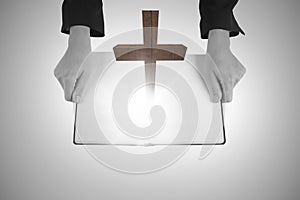 A Composite image of hands holding an open book