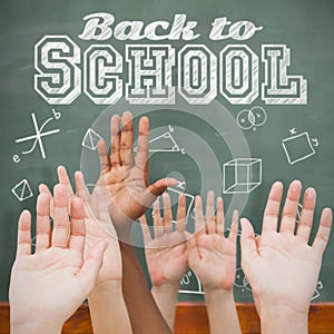 Composite image of hands raising in the air