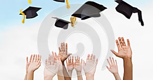 Composite image of hands raising in the air