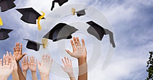 Composite image of hands raising in the air