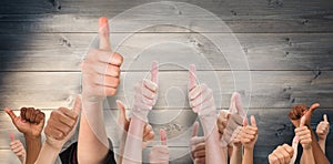 Composite image of hands showing thumbs up