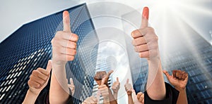 Composite image of hands showing thumbs up