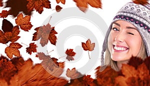 Composite image of happy blonde in winter clothes posing