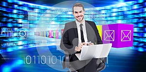 Composite image of happy businessman with laptop using smartphone